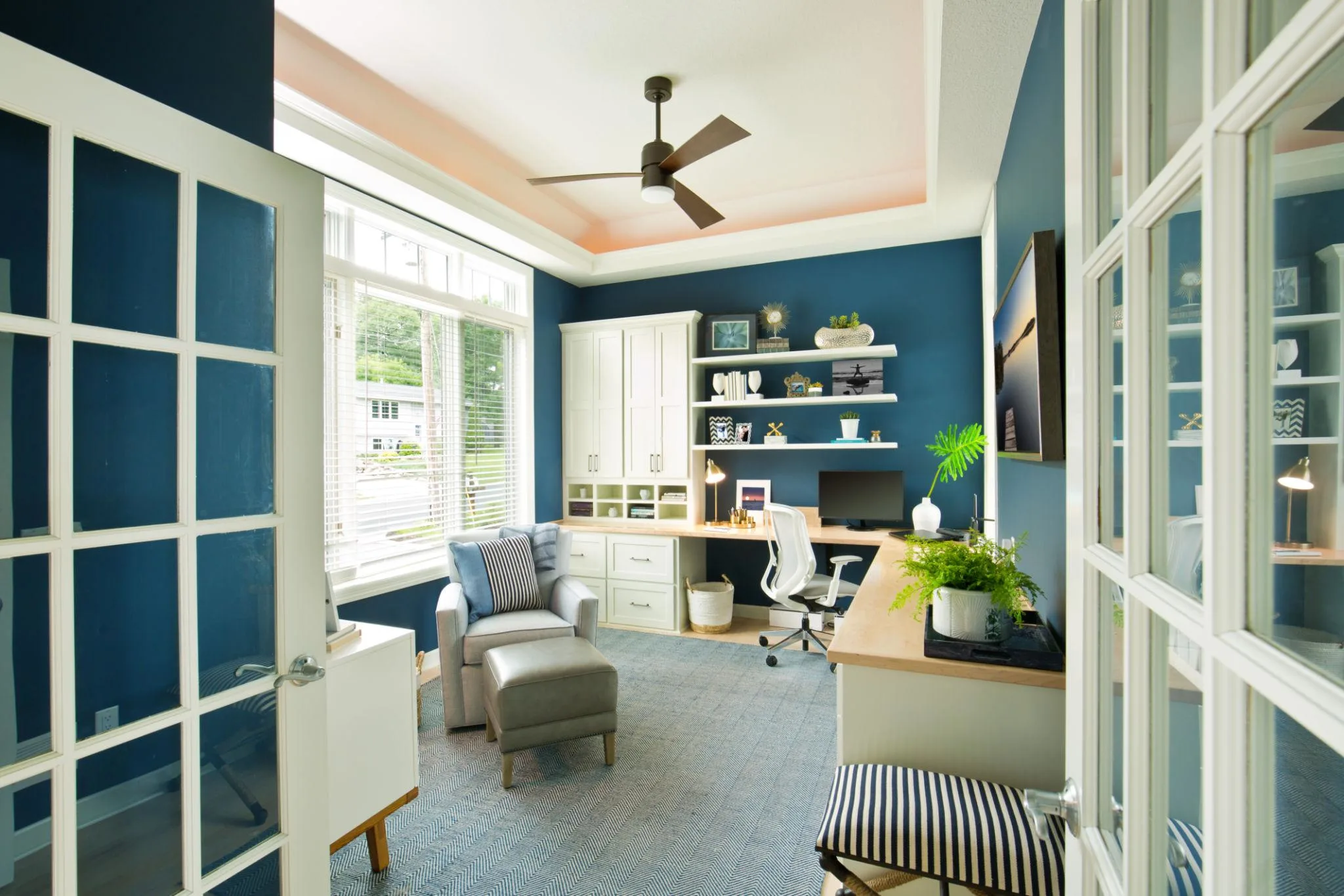Modern living room featuring a sleek wall-mounted Dyson fan providing efficient airflow in a contemporary home interior.