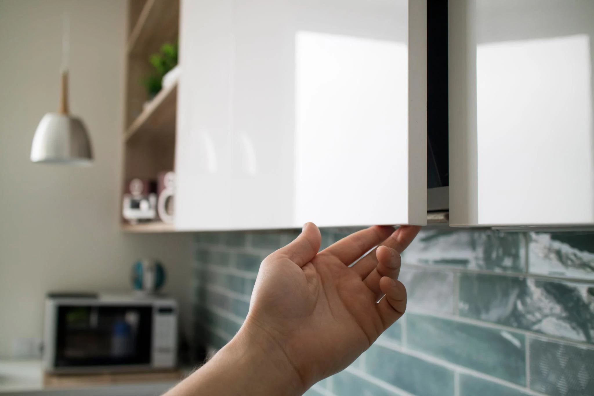 Handleless cabinetry using recessed groove handles for a sleek minimalist look.